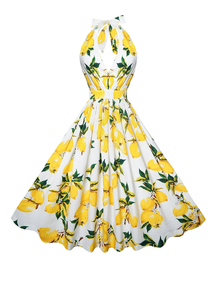 Dress with lemon print on a white background